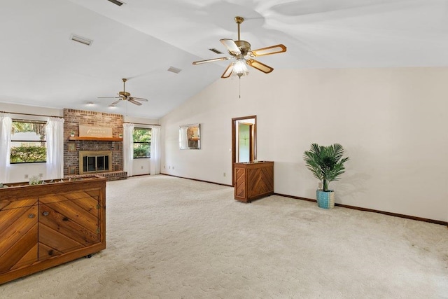 36 Lee Dr, Saint Augustine, FL 32080 - unfurnished living room with a ceiling fan, carpet, baseboards, a brick fireplace, and high vaulted ceiling