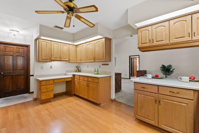 36 Lee Dr, Saint Augustine, FL 32080 - kitchen featuring a ceiling fan, light countertops, and light wood-type flooring