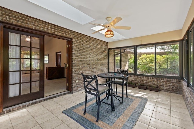 36 Lee Dr, Saint Augustine, FL 32080 - sunroom with brick wall, tile patterned flooring, and a skylight