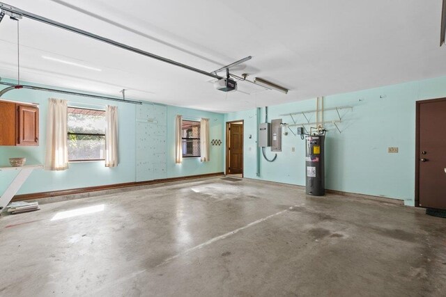 36 Lee Dr, Saint Augustine, FL 32080 - garage featuring water heater, a garage door opener, and electric panel