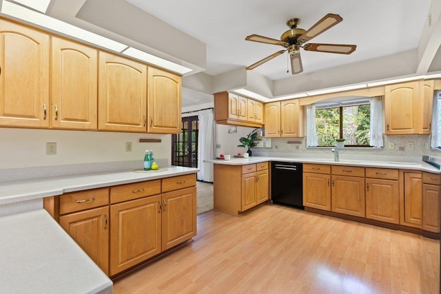 36 Lee Dr, Saint Augustine, FL 32080 - kitchen featuring black dishwasher, light wood-style flooring, a ceiling fan, decorative backsplash, and light countertops