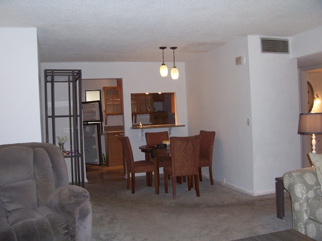 dining room with carpet and baseboards