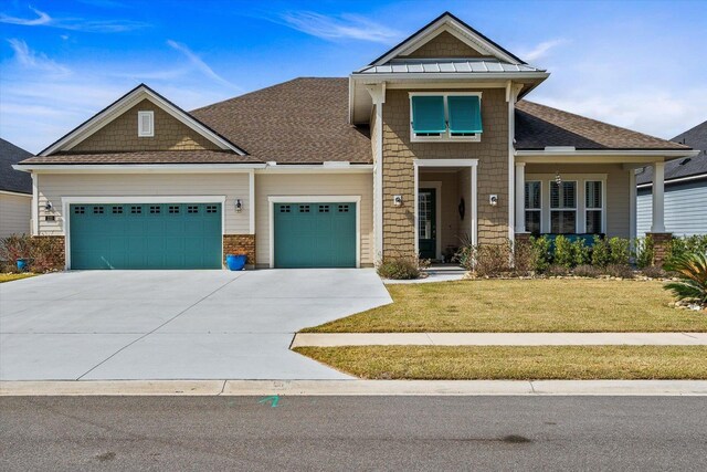 122 Kendall Way, Saint Augustine, FL 32092 - view of front of property with an attached garage, driveway, a front yard, and roof with shingles