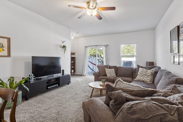 living room featuring carpet floors and ceiling fan