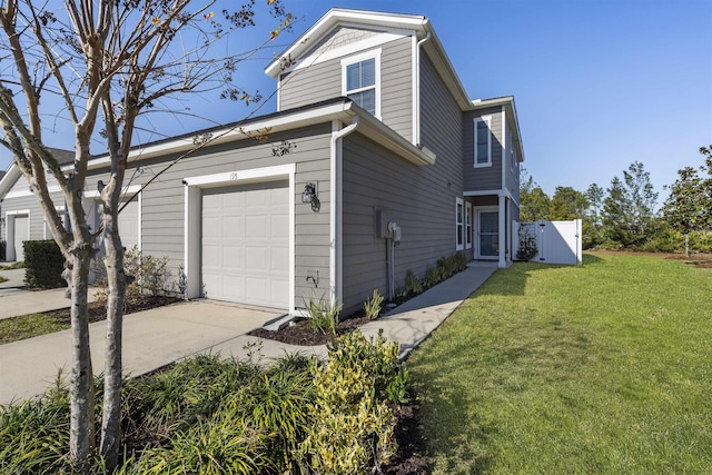 view of property exterior with a garage and a lawn