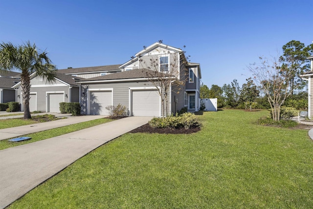 view of front facade with a garage and a front lawn