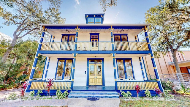 view of front of home with a porch and a balcony