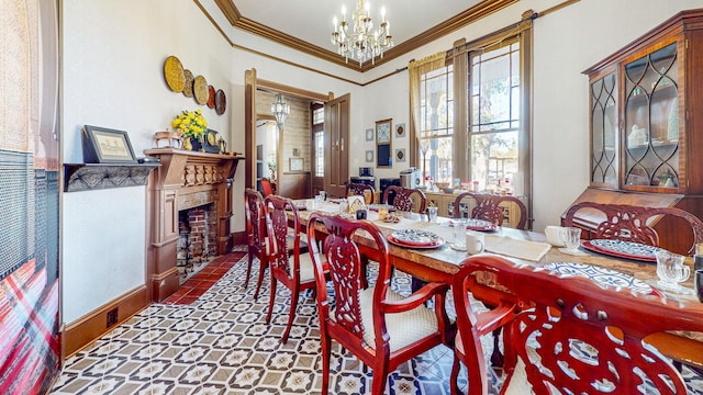 dining area with ornamental molding and an inviting chandelier