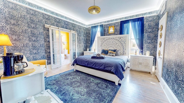 bedroom featuring crown molding and wood-type flooring