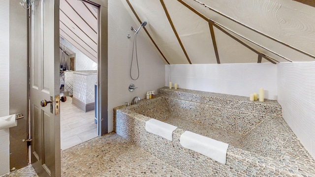 bathroom featuring vaulted ceiling