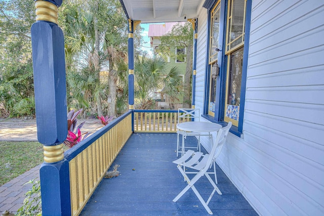 wooden terrace featuring a porch