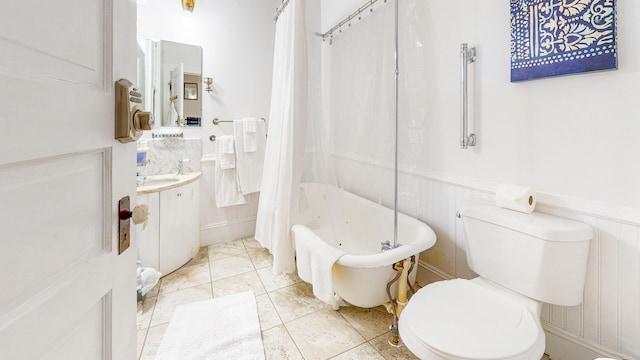 full bathroom with vanity, toilet, and shower / bath combo with shower curtain