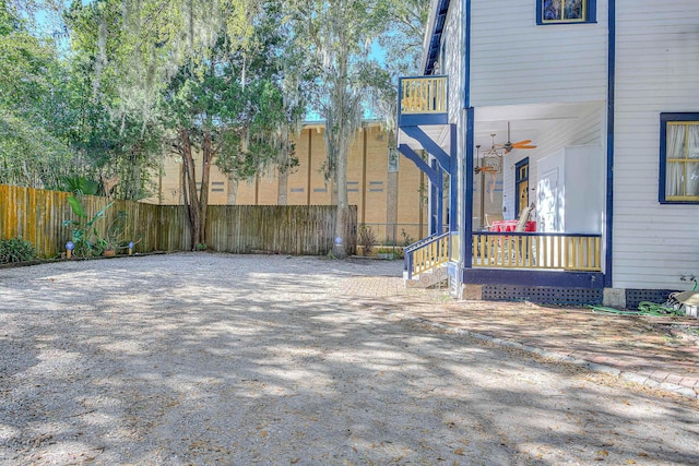 exterior space with ceiling fan