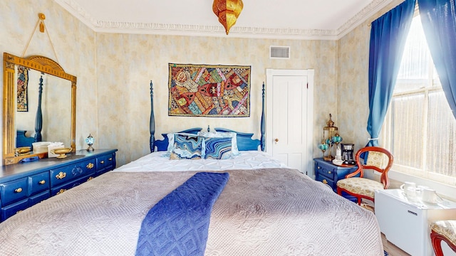 bedroom with crown molding