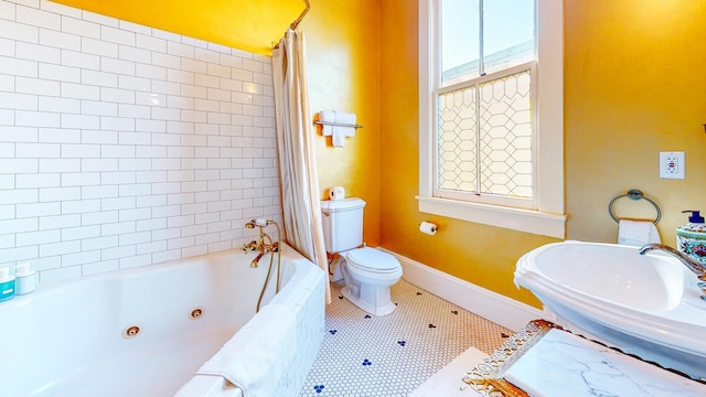 full bathroom featuring tile patterned floors, shower / tub combo, toilet, and sink