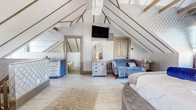 bedroom featuring vaulted ceiling and a notable chandelier