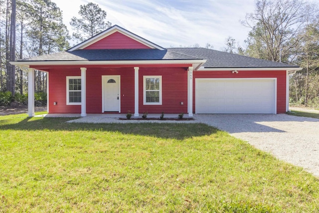 view of front of home featuring a front yard and a garage