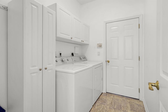 546 Sevilla Dr, Saint Augustine, FL 32086 - laundry area with independent washer and dryer and cabinet space