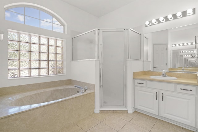 546 Sevilla Dr, Saint Augustine, FL 32086 - full bathroom featuring a shower stall, tile patterned flooring, vanity, and a bath