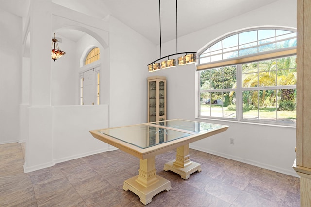 546 Sevilla Dr, Saint Augustine, FL 32086 - unfurnished dining area featuring arched walkways and lofted ceiling