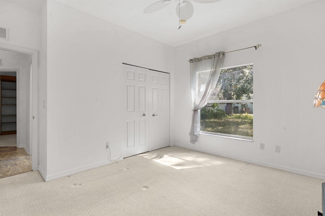 546 Sevilla Dr, Saint Augustine, FL 32086 - unfurnished bedroom featuring carpet, a closet, and ceiling fan