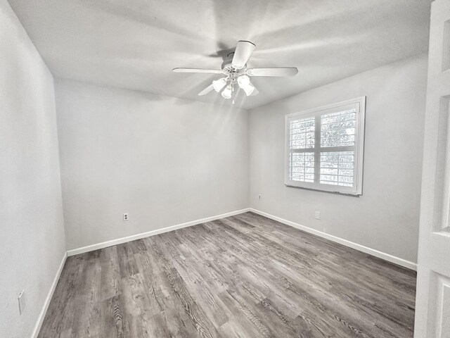 104 Falcon Rd, Saint Augustine, FL 32086 - empty room featuring ceiling fan, dark wood finished floors, and baseboards
