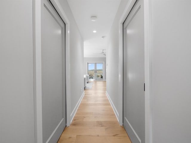 hall with light hardwood / wood-style flooring