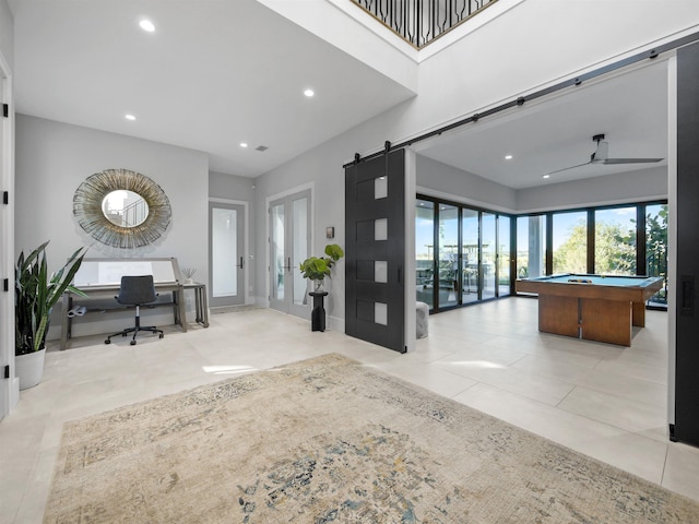 entrance foyer featuring ceiling fan and billiards