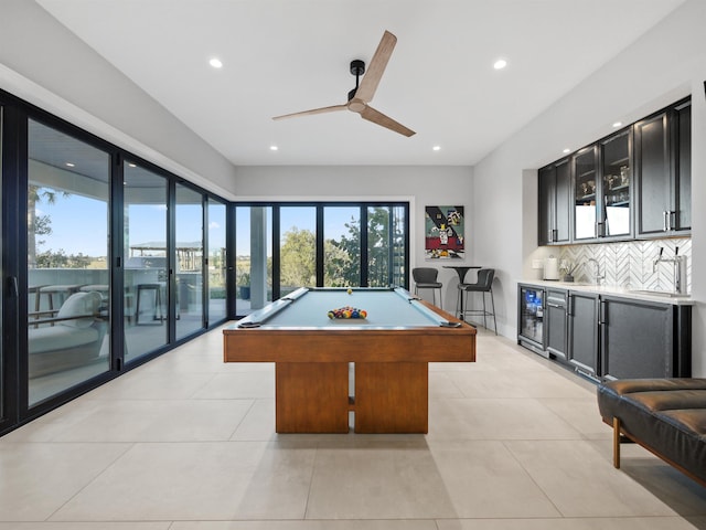 recreation room with indoor bar, wine cooler, billiards, ceiling fan, and light tile patterned floors