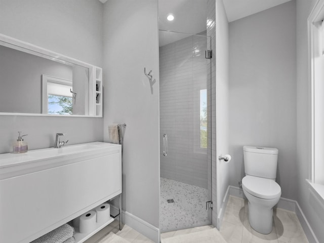 bathroom featuring toilet, walk in shower, and vanity