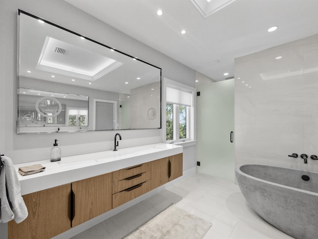 bathroom featuring vanity, shower with separate bathtub, and tile patterned flooring