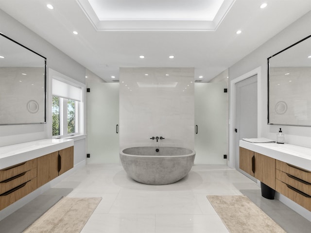 bathroom featuring vanity, tile patterned flooring, separate shower and tub, and a tray ceiling