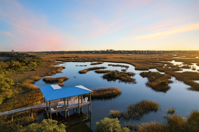 property view of water featuring a rural view and a boat dock