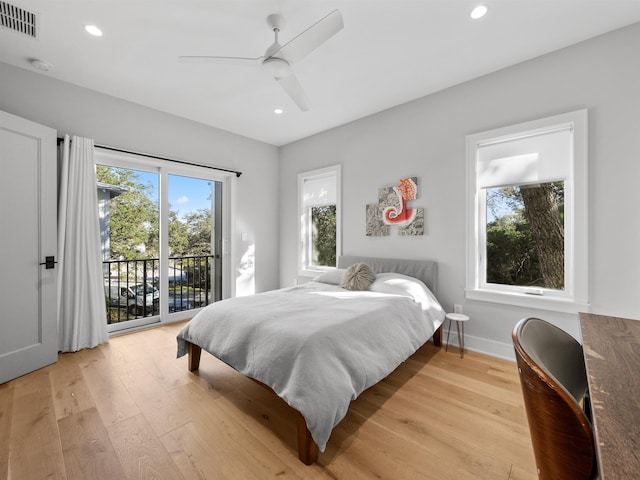 bedroom with light hardwood / wood-style floors, ceiling fan, and access to outside