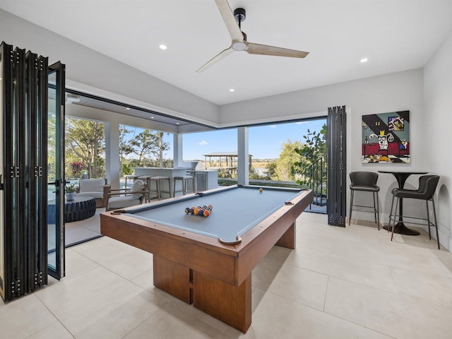 playroom featuring ceiling fan, plenty of natural light, light tile patterned floors, and billiards