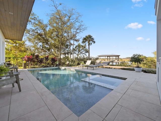 view of swimming pool with a gazebo and a patio