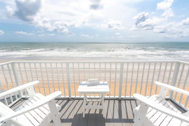 balcony with a view of the beach and a water view