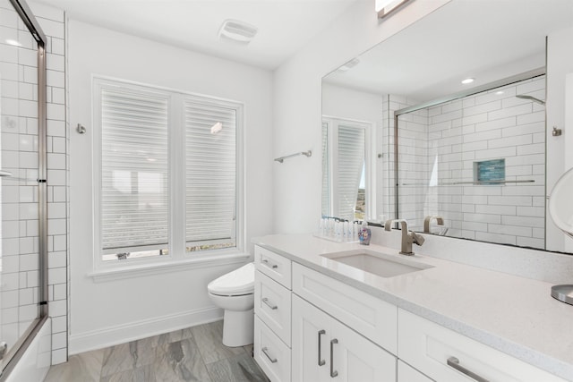 full bath featuring visible vents, toilet, vanity, and baseboards