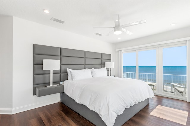 bedroom featuring access to exterior, visible vents, and multiple windows