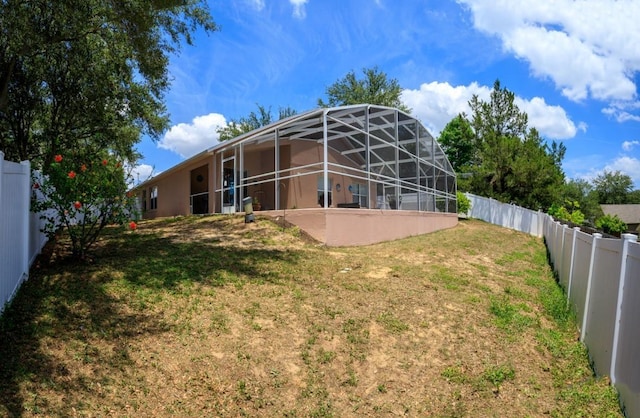 1505 Sundown Ln, Clermont, FL 34711 - back of house featuring a lanai