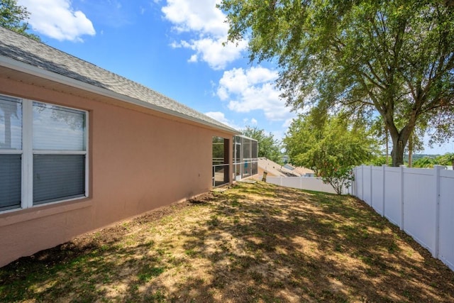 1505 Sundown Ln, Clermont, FL 34711 - fenced backyard with a lanai