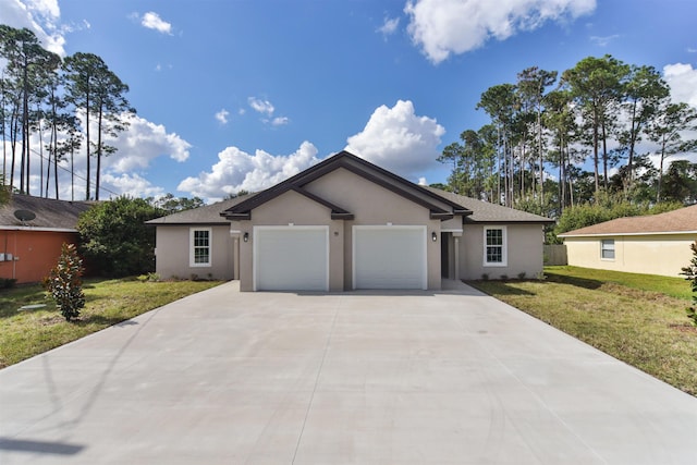 ranch-style house featuring a garage and a front yard