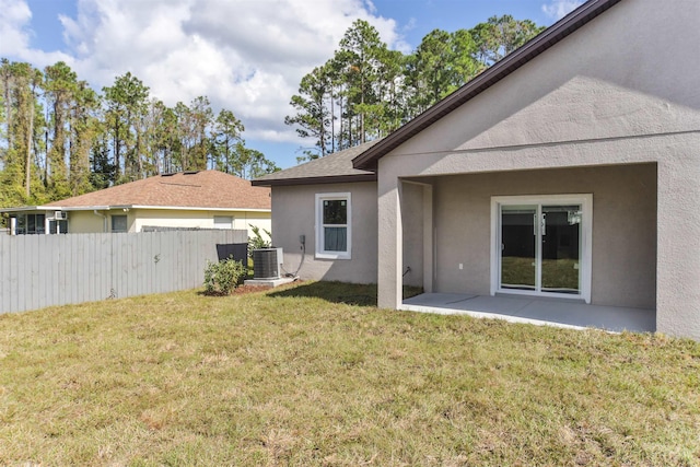 view of yard featuring central AC unit and a patio area