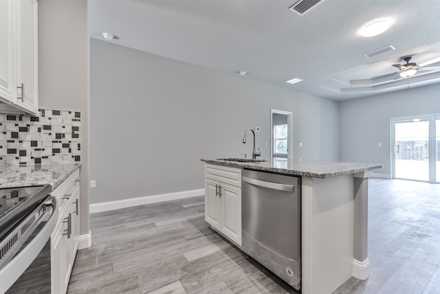 kitchen with white cabinets, stainless steel appliances, plenty of natural light, and sink