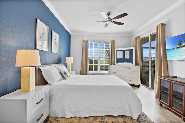 bedroom featuring access to exterior, ceiling fan, light hardwood / wood-style flooring, and ornamental molding