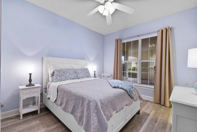 bedroom with hardwood / wood-style flooring and ceiling fan