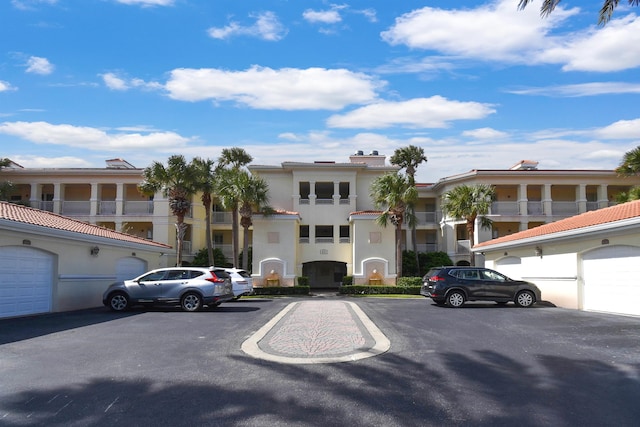 435 N Ocean Grande Dr Unit 104, Ponte Vedra Beach, FL 32082 - view of front of house with stucco siding and uncovered parking