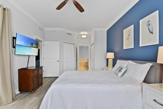 435 N Ocean Grande Dr Unit 104, Ponte Vedra Beach, FL 32082 - bedroom with wood finished floors, crown molding, connected bathroom, and a ceiling fan