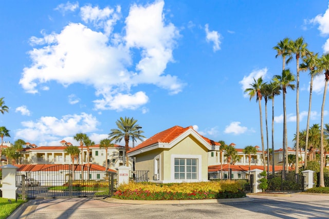 435 N Ocean Grande Dr Unit 104, Ponte Vedra Beach, FL 32082 - view of front of home with a gate, stucco siding, and a residential view