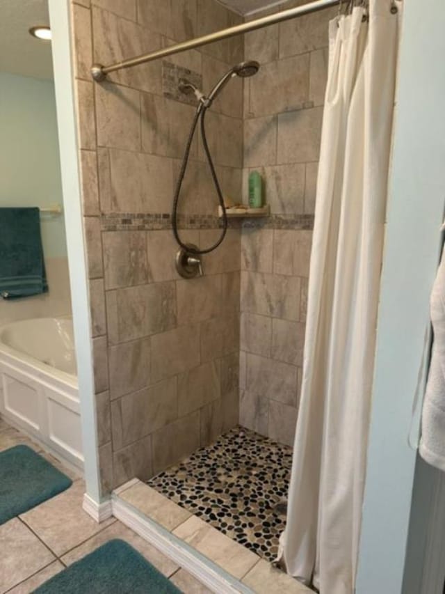 bathroom featuring a shower with curtain and tile patterned floors